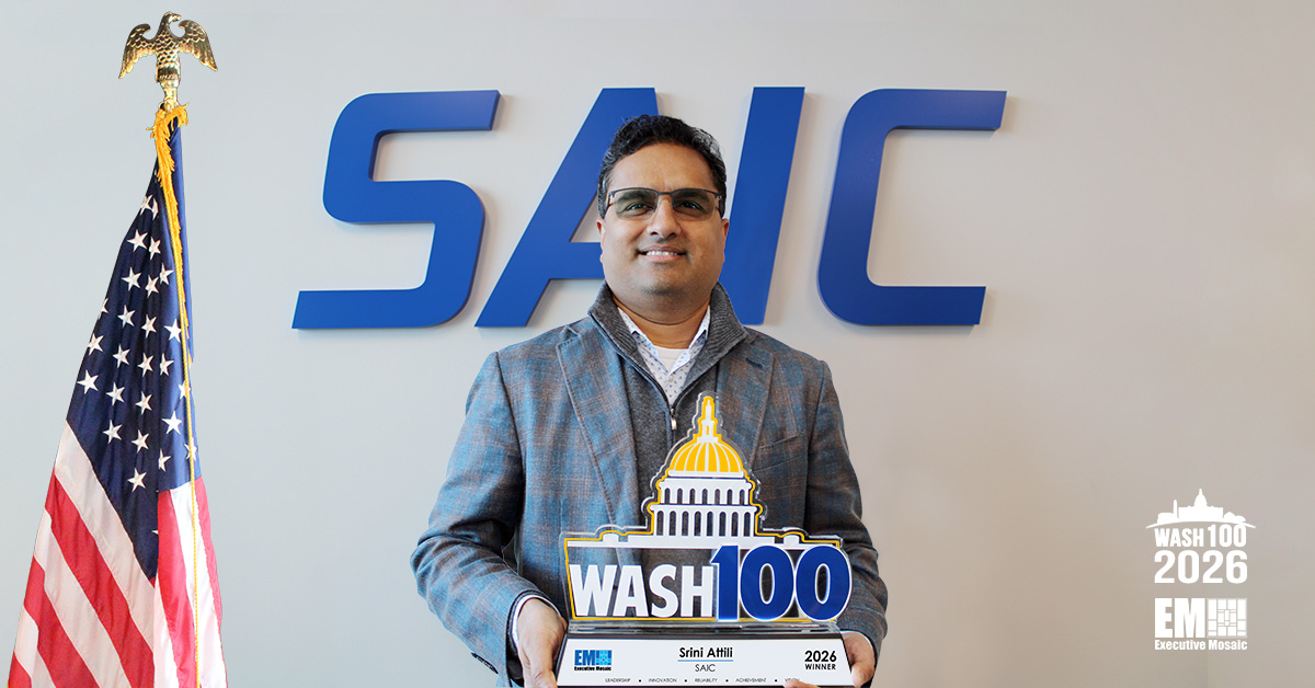 Srini Attili, executive vice president of SAIC’s civilian business group, holding the 2026 Wash100 Award.