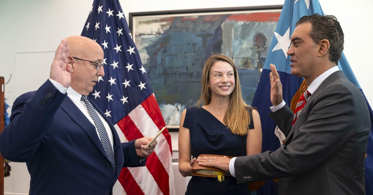 Emil Michael, right, being sworn into office as Pentagon under secretary of war for research and engineering.