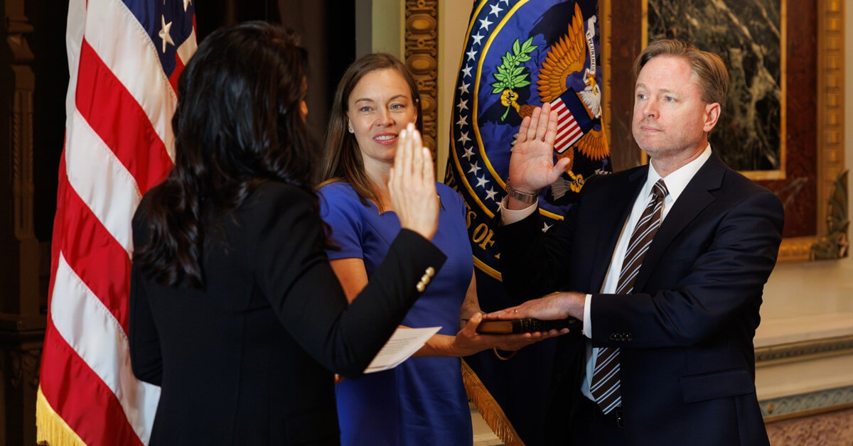 Aaron Lukas and Tulsi Gabbard. The director of national intelligence swears in her principal deputy in July 2025.