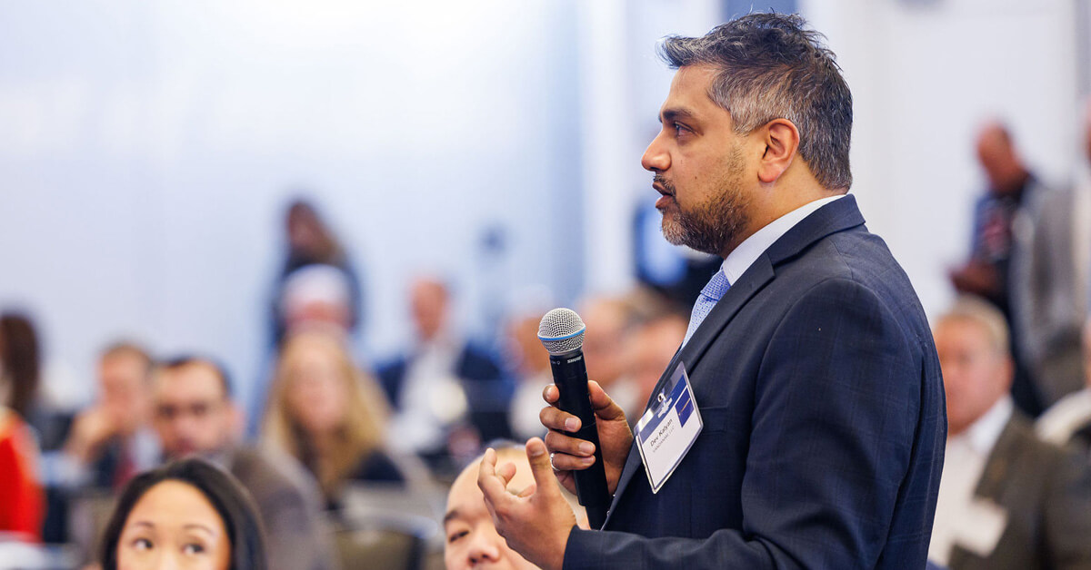An audience member asks a question at a Potomac Officers Club event