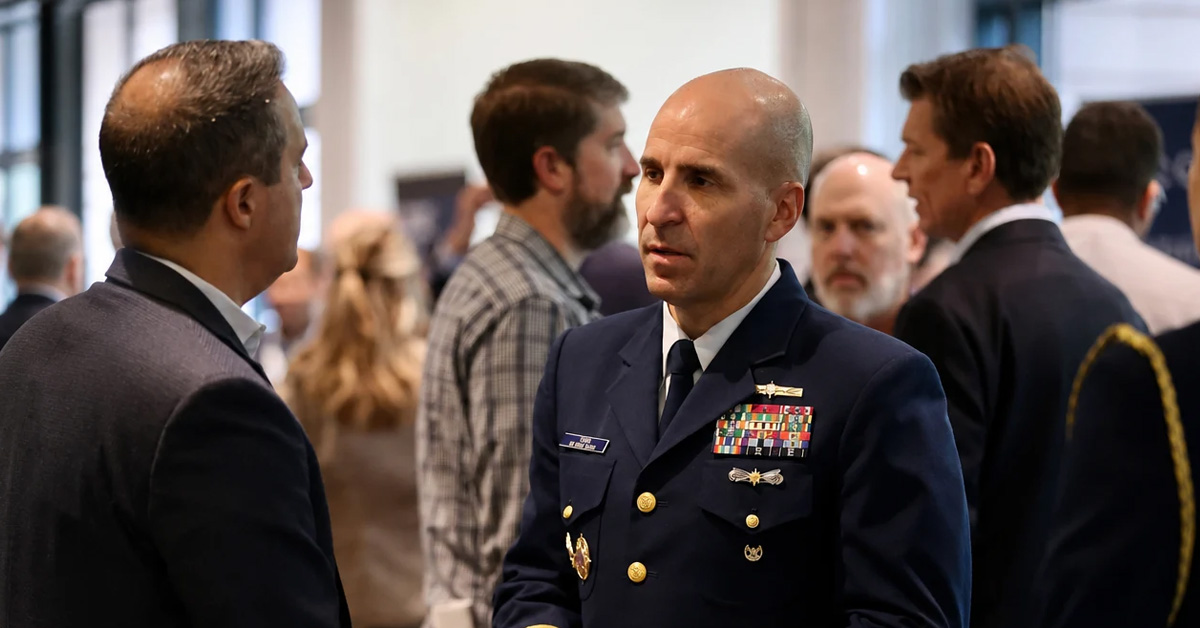 Jason Tama and event attendee. The Coast Guard RADM and cyber commander spoke with guests at the 2026 Cyber Summit from Potomac Officers Club.