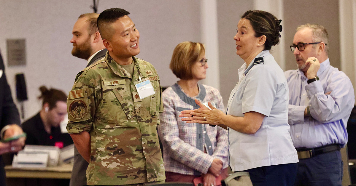 Gang Wang and Cyber Summit attendee. The Air Force cyberspace operations officer attended Potomac Officers Club's 2026 Cyber Summit and spoke with other guests.